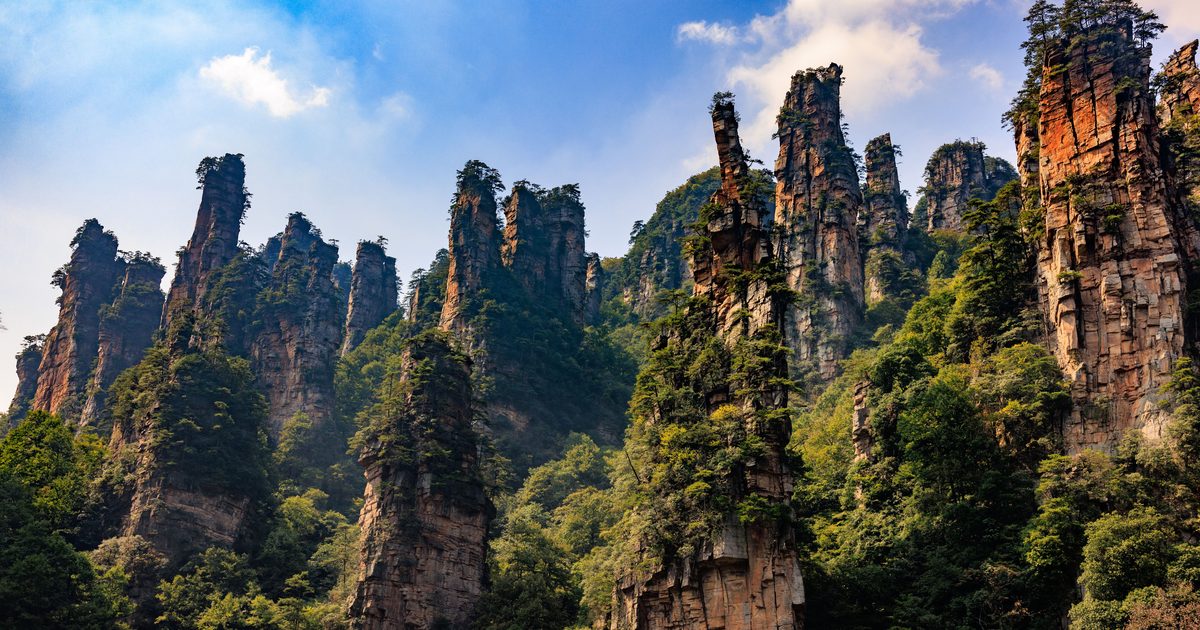 Sandstone pillars in Zhangjiajie, Hunan, rising out of green forest